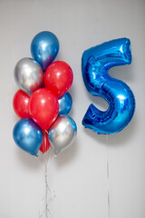 Wall Mural - blue number 5 foil balloon and a bunch of helium balloons