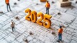 © Edi Purnomo - Miniature figures surround the number 2025 on blueprints, representing planning and development for the new year.