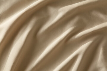 Closeup image of silky tan fabric