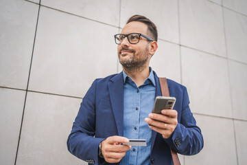 Businessman have online shopping on mobile phone with credit card