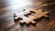 © Penatic Studio - Two Interlocking Wooden Puzzle Pieces on a Brown Wooden Surface