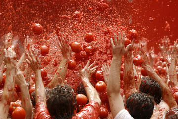 People Celebrating at the Tomato Festival: A Vibrant and Fun-Filled Event Featuring Tomato-Based Activities and Festivities