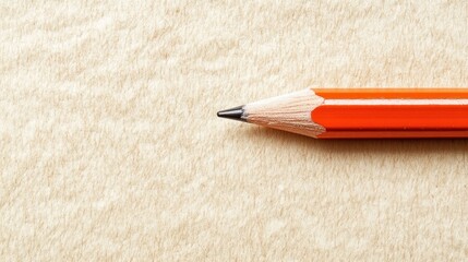 Poster - Red Pencil Laying on a Beige Textured Paper Surface