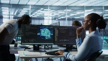 Poster - Engineer waiting at PC desk for checkup to be done on AI server room providing computing resources. African american woman investigating data center mainframes using computer, camera B