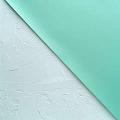 Poster - A mint green sheet of paper gently drapes over a textured white wall, creating a minimalist and modern contrast. The soft hues and clean lines evoke a serene and artistic atmosphere.
