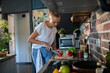 © Geber86 - Young woman cooking healthy vegetables in modern kitchen
