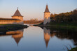 Ancient city towers on the Pskova river on a October morning. Pskov, Russia