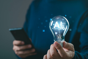 A person holding a light bulb with AI graphics, symbolizing innovation and technology in a digital age.