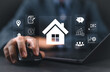 © Nirusmee - Real estate investment concept. Man use laptop with house icon for analyzing mortgage loan home and insurance real property mortgage. interest rate, Investment planning, business real estate.