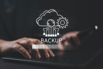 Fototapete - Backup concept, Online digital data storage and connection service. Businessman use laptop with Backup status bar for data backup management.
