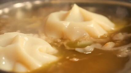 Wall Mural - Meat dumplings in boiling water