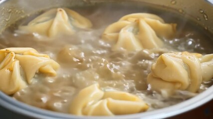 Wall Mural - Meat dumplings in boiling water