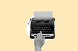 © chayanit - Vintage typewriter with blank paper sheet on yellow background. Art collage digital pop modern art