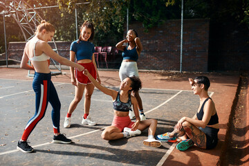 Wall Mural - People, greeting and basketball team for fist bump, outdoor and support players on sports court. Women, communication and plan for game strategy on playground, together and hello at fitness training