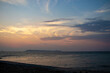 © Andryukha - horizontal view of sea and mountain in the evening after sunset