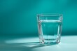 © Michael - Glass of fresh water on a vibrant teal background casting a dramatic shadow