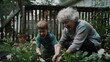 © VK Studio - A grandmother joyfully tends to plants with her grandson, both smiling amid the lush greenery of a vibrant garden.