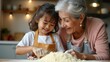 © SerPak - A grandmother and her young granddaughter share a happy moment while baking in a warm, inviting kitchen. The child playfully touches the flour as they prepare to create delicious treats together.