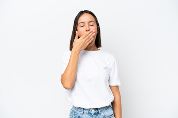 Young caucasian woman isolated on white background yawning and covering wide open mouth with hand