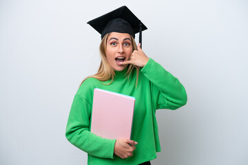 Canvas Print - Young university graduate woman isolated on white background making phone gesture. Call me back sign