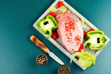 Wall Mural - A photo of raw pork on the table.