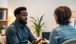© Sergey - Stressed black man explaining his problems to psychologist at individual therapy session at office, copy space isolated with white highlights, png