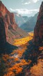 © vadosloginov - A stunning canyon view in autumn showcasing vibrant foliage and majestic rock formations in a peaceful landscape