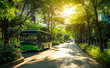 © Curioso.Photography - A green bus travels down a tree-lined city street on a sunny day, representing eco-friendly urban transportation.
