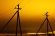 © Anton Belovodchenko - Pillar for electricity wire on twilight time on yellow sky background.
