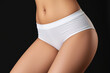 © Vladislav - Promotional photo featuring a mockup of white women’s briefs panties on a clean, minimalist background. Ideal for showcasing lingerie design, fabric texture