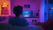 © milenialdesastudio - Young man wearing headphones playing video games on TV at home.