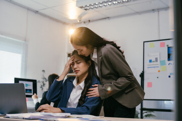 Poster - Stressed businesswoman with headache seeks support from caring manager in busy office. Display emphasizes mental health importance in workplace