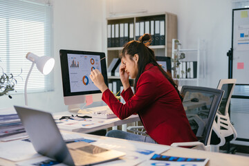 Poster - Young office worker suffering from headache and eyestrain while working on computer and analyzing marketing data in office
