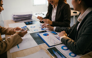Fototapete - Business team working together analyzing financial data using graphs and charts showing company performance during meeting in office, discussing new strategy for next quarter