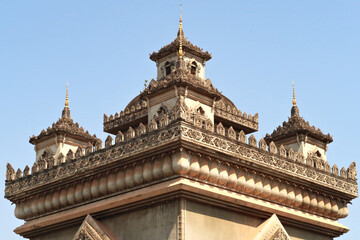 Wall Mural - The elaborate roof and turrets, towers of the Patuxai Monument, decorated with a lot of stucco in different shapes and patterns, Vientiane, Laos