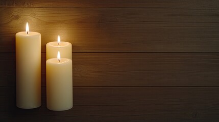 Wall Mural - candles are lit and surrounded by pine branches, creating a cozy Christmas atmosphere with two unlit candles nearby