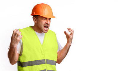 Poster - Building Problems Concept. Mad Construction Worker Gesturing Emotionally And Shouting In Anger Posing Standing Over White Studio Background, Looking Aside. Panorama With Blank Space For Text