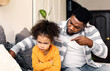 © Prostock-studio - African american father scolds little daughter. Girl offended and turned away