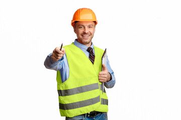 Poster - Happy Builder Pointing Pencil At Camera Holding Folder Standing On White Studio Background. Building Career And Employment.