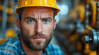 © Bolbik - Portrait of a focused factory worker in yellow safety gear and hard hat, representing industrial labor