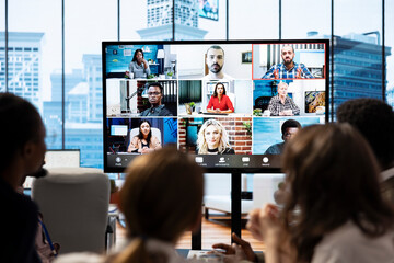 Poster - Briefing meeting between employees and advisory board via videocall network, evaluating monthly reports to increase budget for business development. Work staff discussing with managers.
