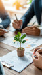 © MP-AI - small potted plant on desk surrounded by diverse professionals discussing marketing plan. atmosphere is collaborative and focused