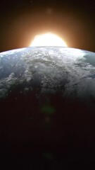 Wall Mural - Vertical Shot of Planet Earth Seen From Space as the Close and Large Sun Rises Up From Behind