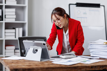 Asian busty employee, Young asian business woman holding paper while working and talking phone at office table, Happy office girl working, business people casual lifestyle