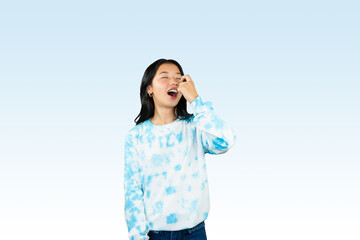 Wall Mural - Yougn Asian girl with blue dress points and gives various expression and gestures isolated happy sad