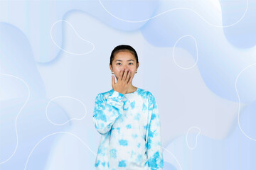 Wall Mural - Yougn Asian girl with blue dress points and gives various expression and gestures isolated happy sad