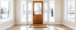 © Adisak - Modern front entrance with a wooden door and large windows, bright and welcoming.