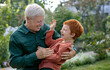© Westend61 - Happy cute boy spending leisure time with grandfather in park