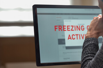 Poster - Closeup of frustrated concerned man using computer and worried about financial problems. A focused man looking at a frozen monitor, contemplating the next steps in account management