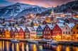 © Wanlop - Enchanting Winter Dusk in Bryggen, Bergen, Norway: A Magical Christmas Scene with Snow-Covered Historic Buildings and Festive Decorations